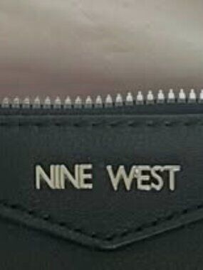 Nine West small black clutch w/short strap one zipper on inside pocket used once